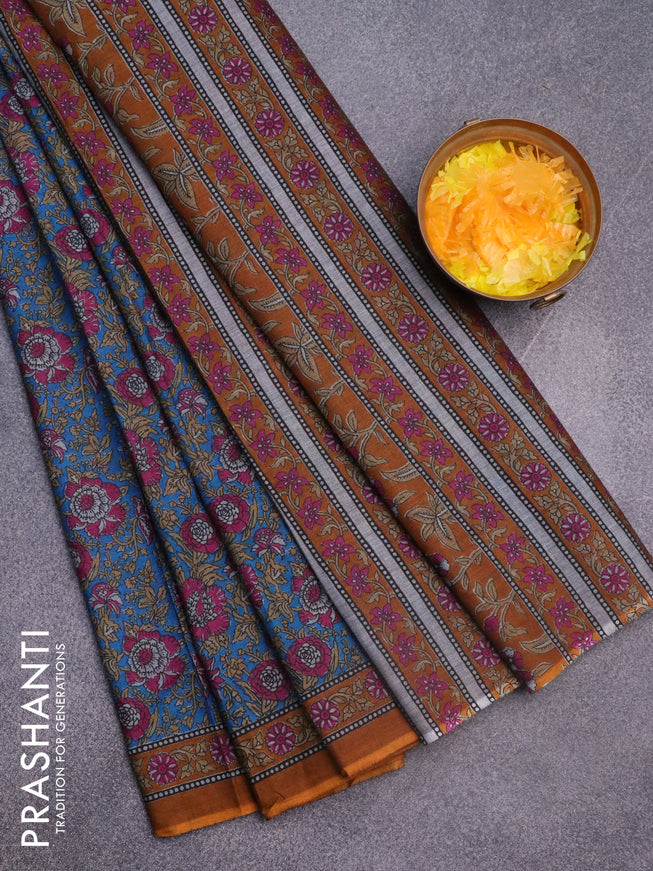 Muslin cotton saree cs blue and mustard shade with allover floral prints and printed border