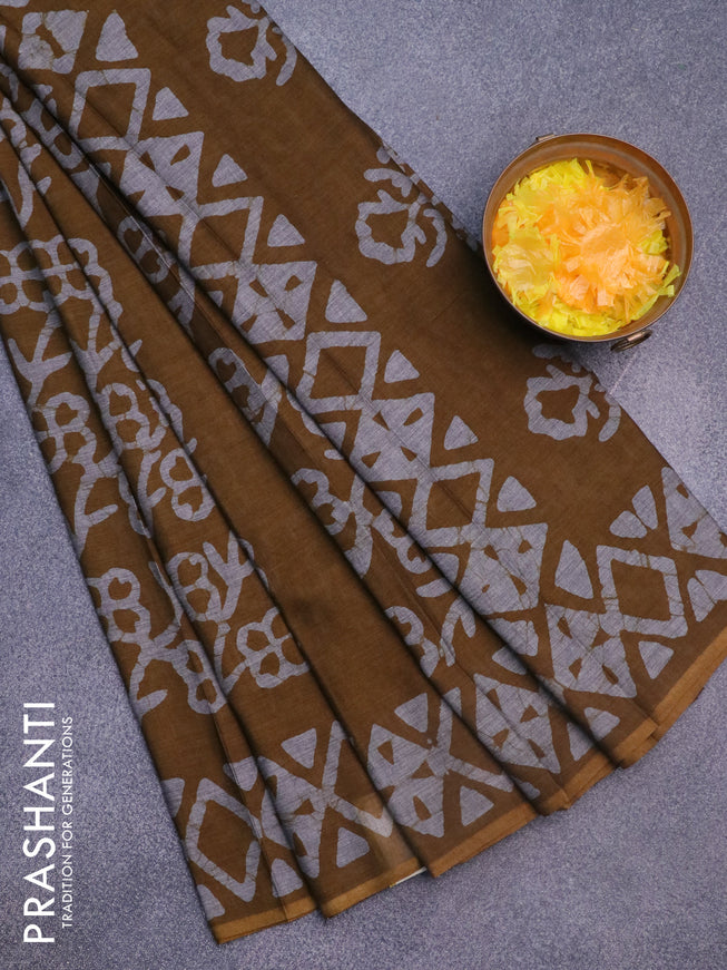 Muslin cotton saree dark mustard with allover batik prints and printed border