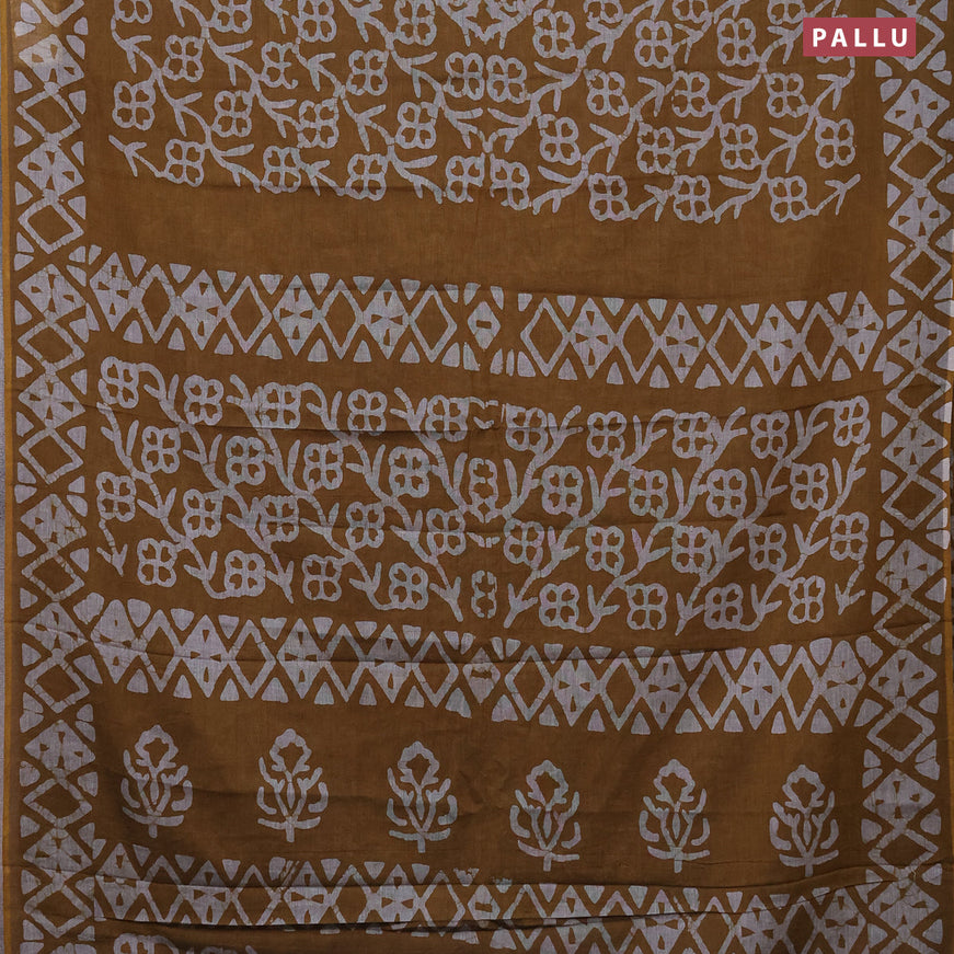 Muslin cotton saree dark mustard with allover batik prints and printed border