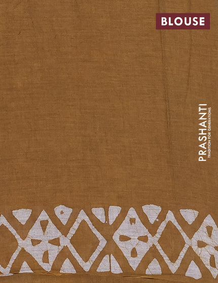 Muslin cotton saree dark mustard with allover batik prints and printed border