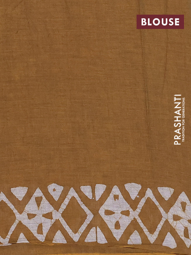 Muslin cotton saree dark mustard with allover batik prints and printed border