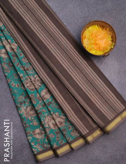 Muslin cotton saree teal green and grey with allover floral prints and zari woven border