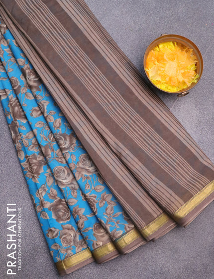 Muslin cotton saree cs blue and grey with allover floral prints and small zari woven border