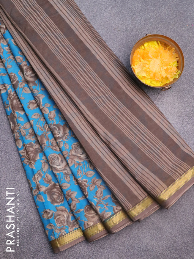 Muslin cotton saree cs blue and grey with allover floral prints and small zari woven border