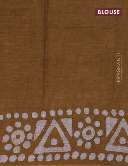 Muslin cotton saree dark mustard with allover batik prints and printed border