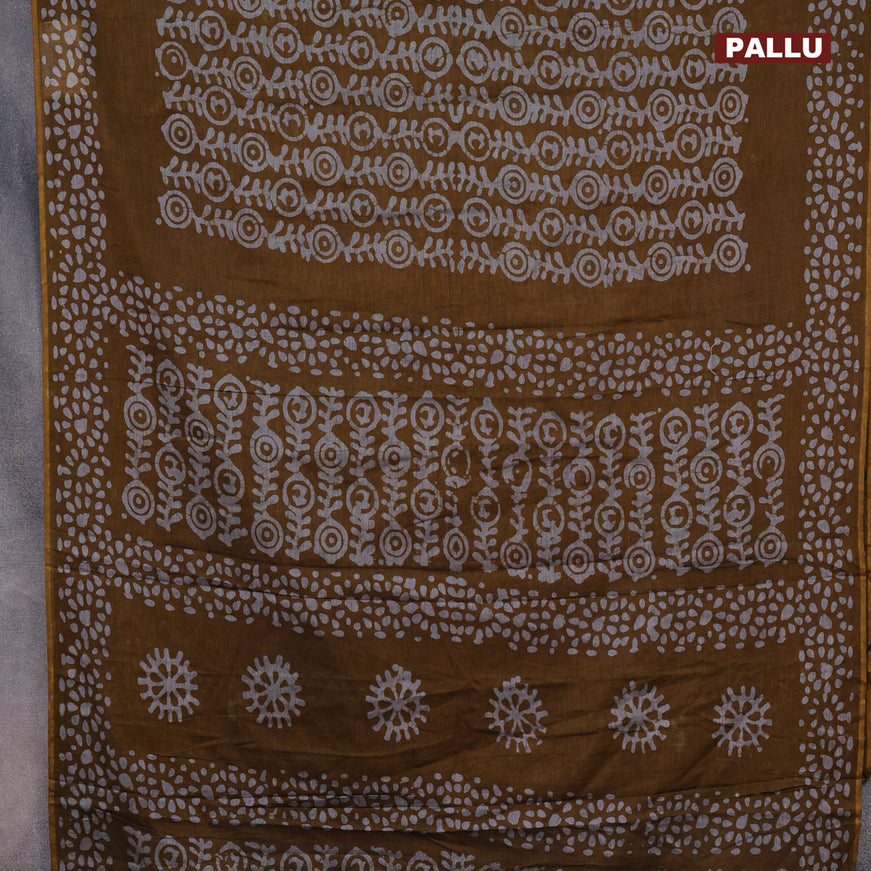 Muslin cotton saree dark mustard and grey with allover batik prints and printed border