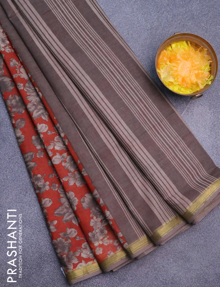 Muslin cotton saree rustic orange and grey with allover floral prints and small zari woven border