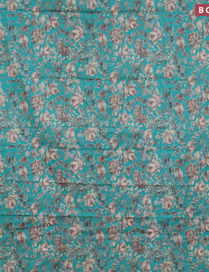 Muslin cotton saree teal green and grey with allover floral prints and small zari woven border