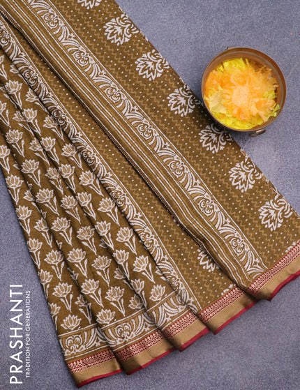 Muslin cotton saree mehendi green and maroon with allover lotus prints and thread woven border