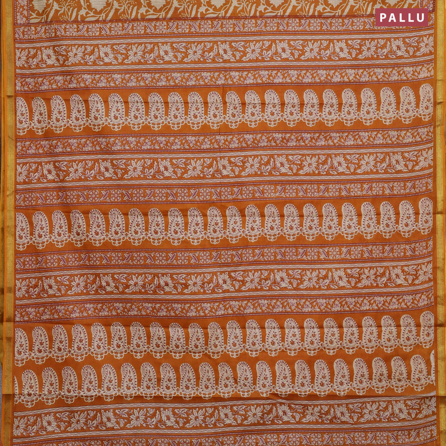 Muslin cotton saree dark mustard with allover floral prints and small zari woven border