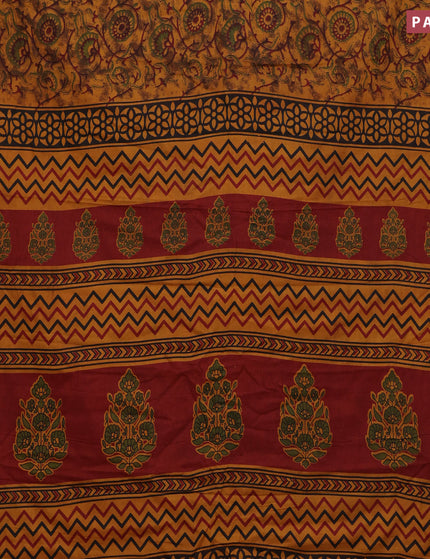 Muslin cotton saree dark mustard and maroon with allover prints and small zari woven border