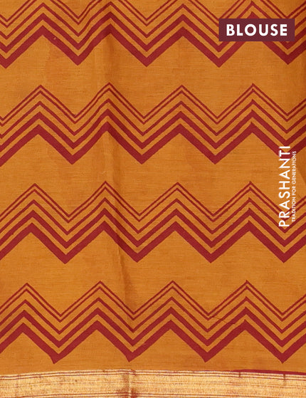 Muslin cotton saree dark mustard and maroon with allover prints and small zari woven border