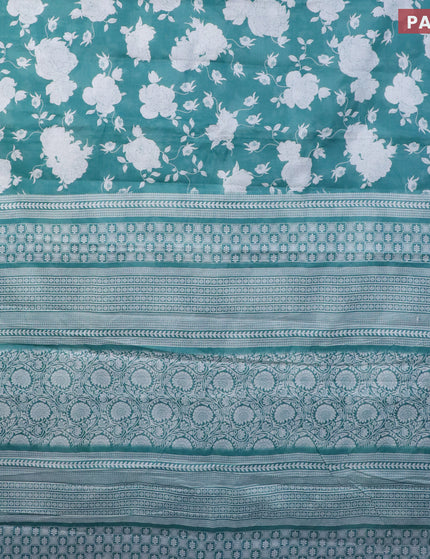 Muslin cotton saree teal green shade and off white with allover floral prints and printed border