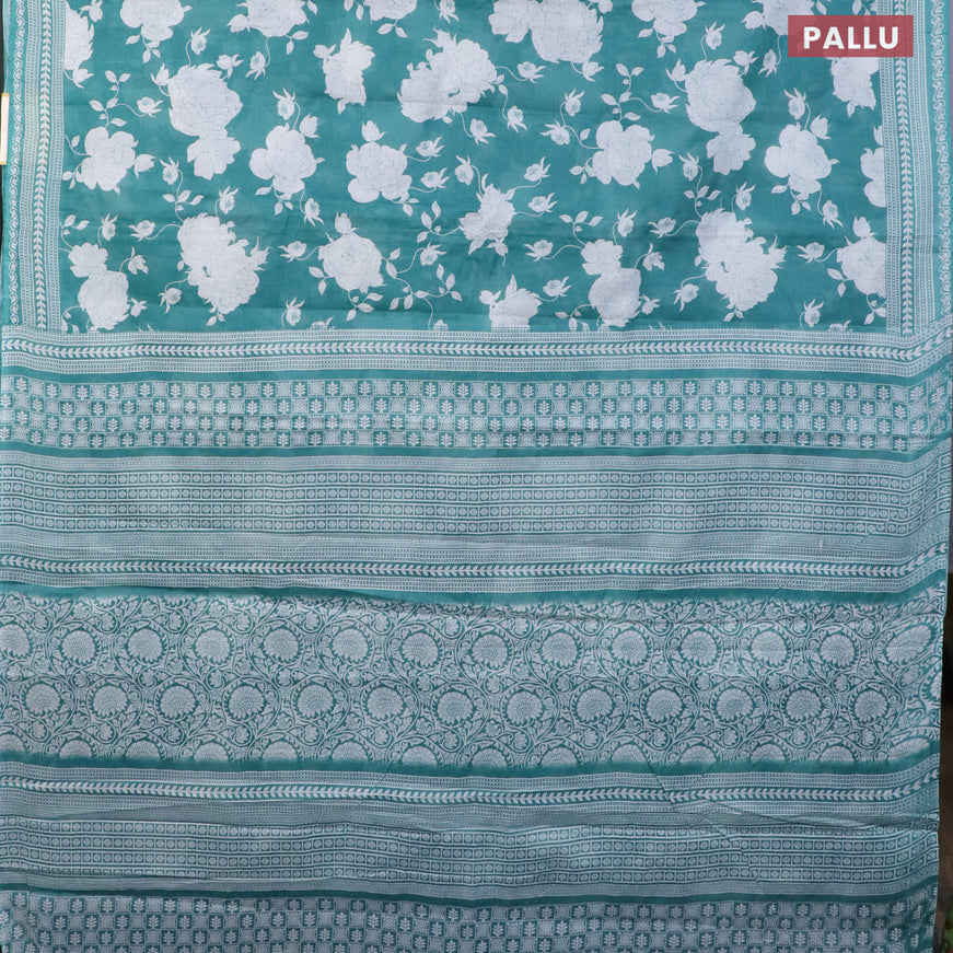 Muslin cotton saree teal green shade and off white with allover floral prints and printed border