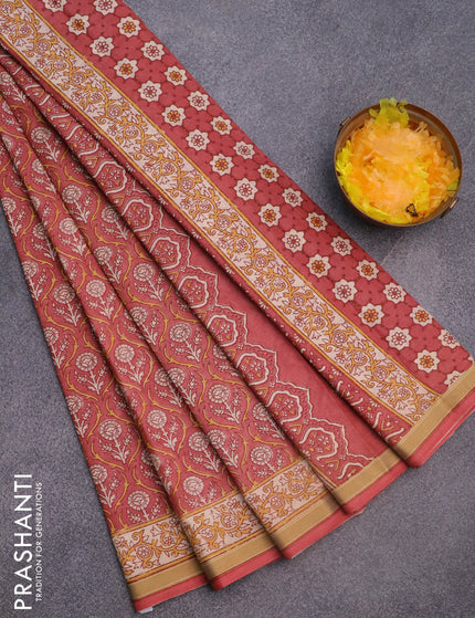 Muslin cotton saree peach shade with allover prints and printed border