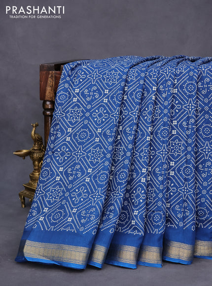 Semi crepe saree peacock blue with allover bandhani prints and zari woven border