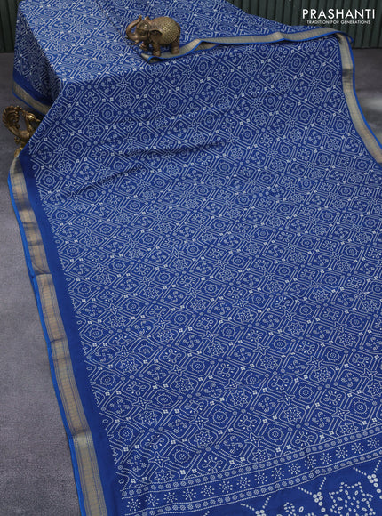 Semi crepe saree peacock blue with allover bandhani prints and zari woven border