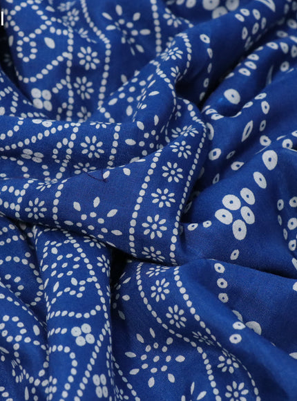 Semi crepe saree peacock blue with allover bandhani prints and zari woven border