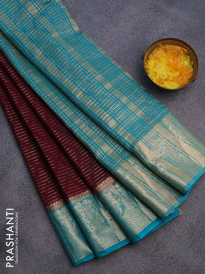 Semi crepe saree deep maroon and teal blue with allover zari weaves and zari woven border