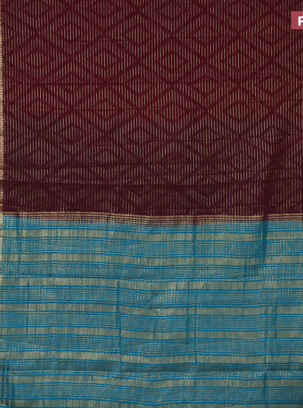 Semi crepe saree deep maroon and teal blue with allover zari weaves and zari woven border