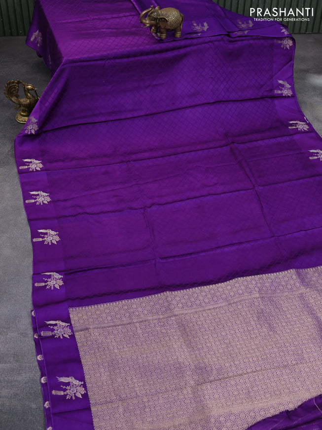 Mushru silk saree violet with allover self emboss and zari woven butta border