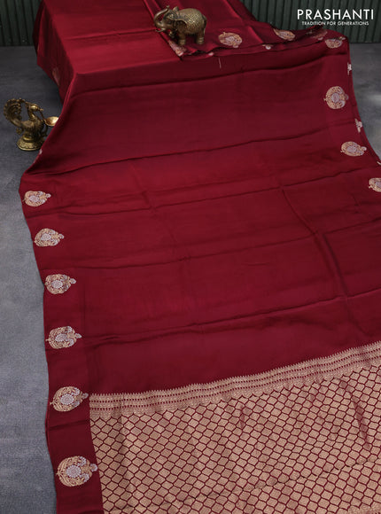 Mushru silk saree maroon with allover self emboss and zari woven butta border