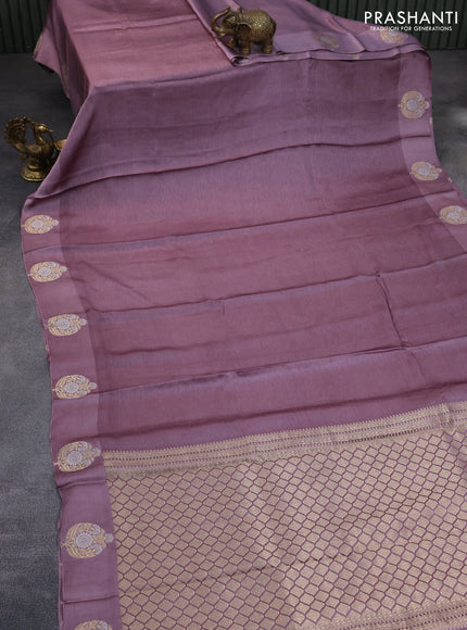 Mushru silk saree pastel purple with allover self emboss and zari woven butta border