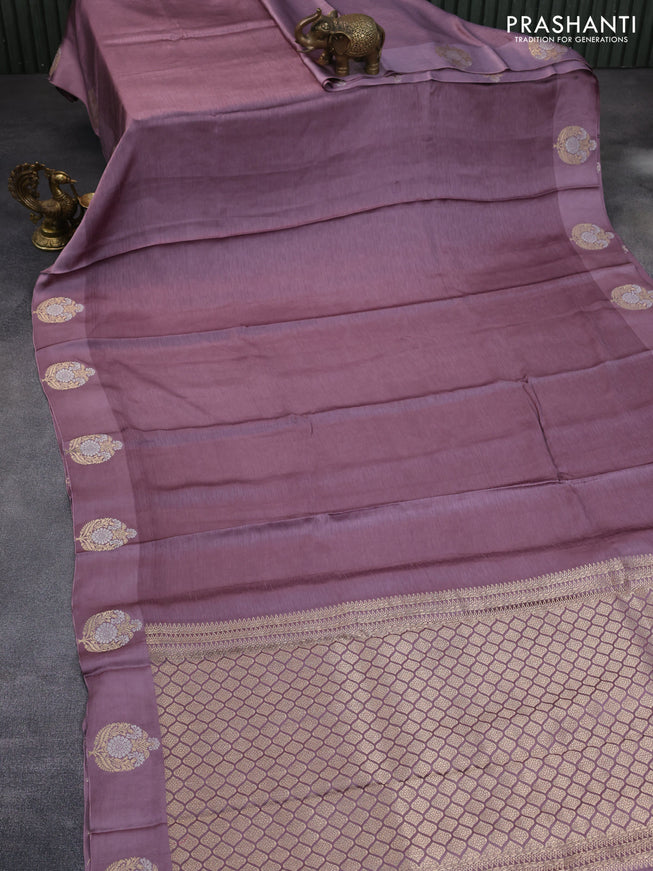 Mushru silk saree pastel purple with allover self emboss and zari woven butta border