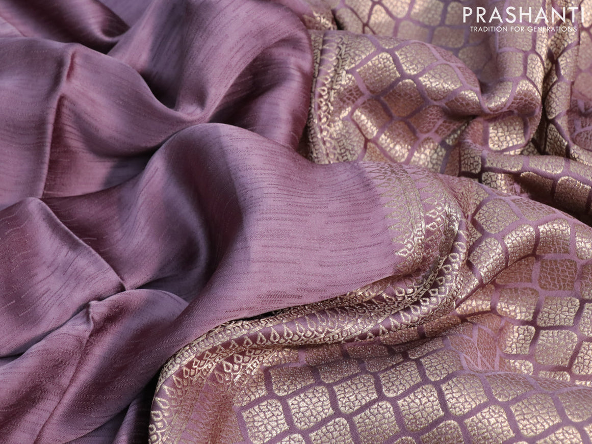 Mushru silk saree pastel purple with allover self emboss and zari woven butta border