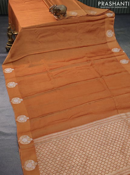 Mushru silk saree dark mustard with allover self emboss and zari woven butta border