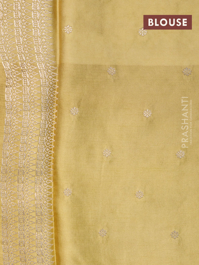 Mushru silk saree lime green with allover self emboss and zari woven butta border