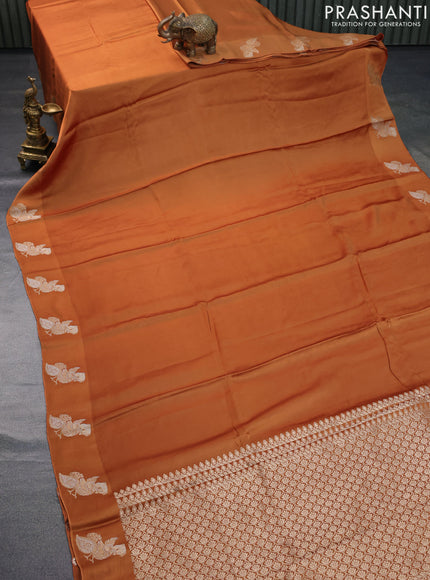 Mushru silk saree rust shade with plain body and annam zari woven butta border