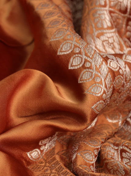 Mushru silk saree rust shade with plain body and annam zari woven butta border