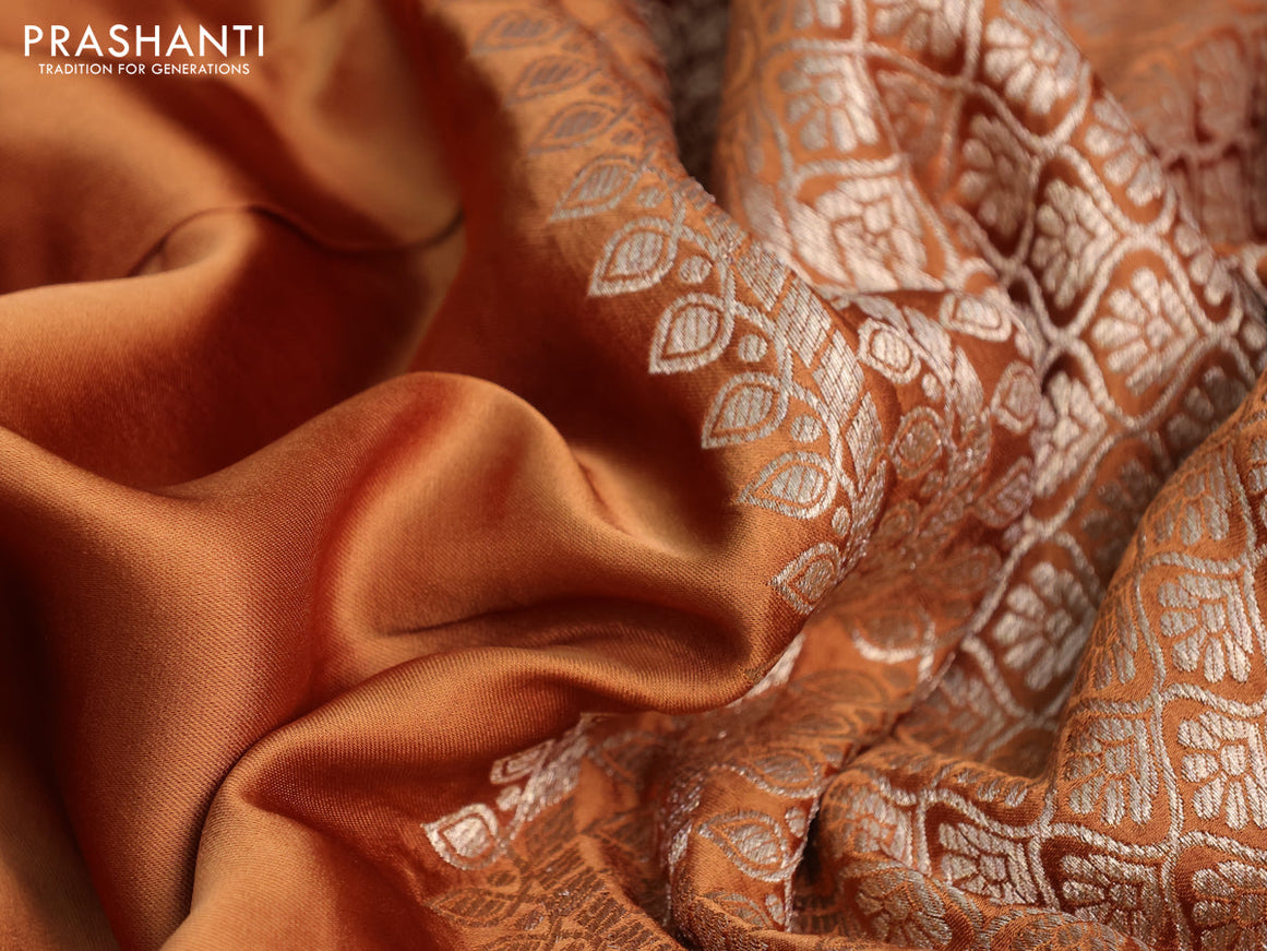 Mushru silk saree rust shade with plain body and annam zari woven butta border