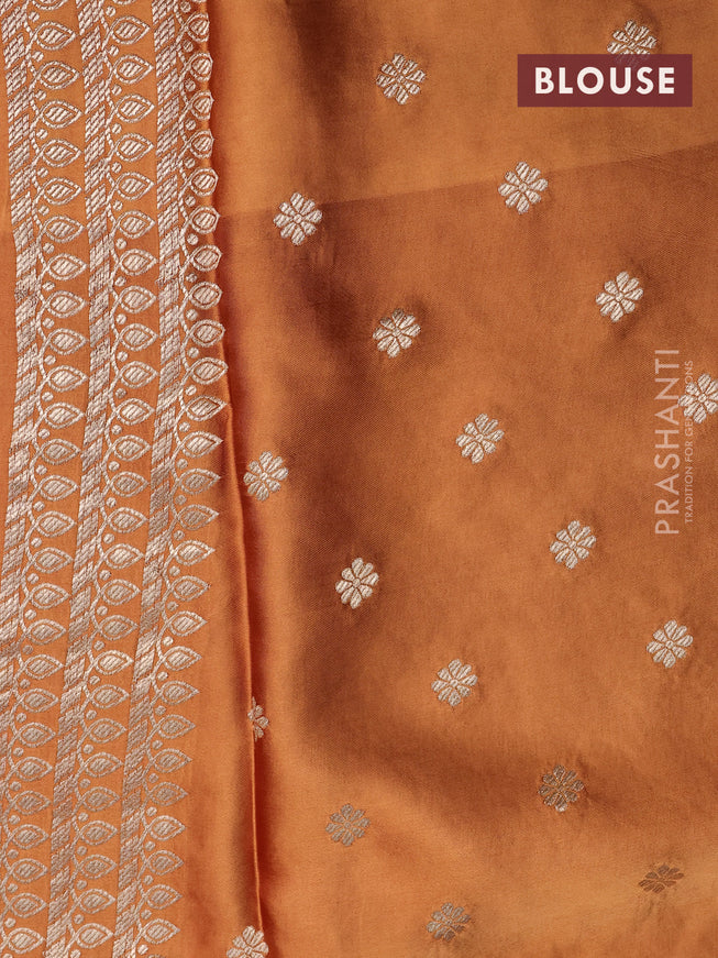 Mushru silk saree rust shade with plain body and annam zari woven butta border