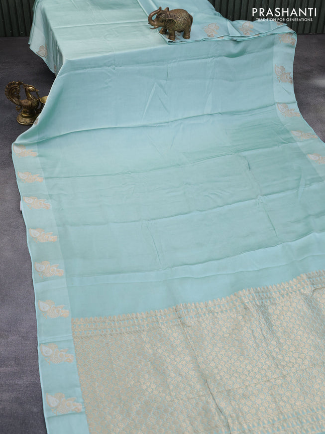 Mushru silk saree pastel blue with plain body and annam zari woven butta border