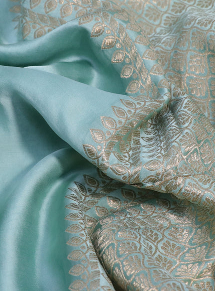 Mushru silk saree pastel blue with plain body and annam zari woven butta border