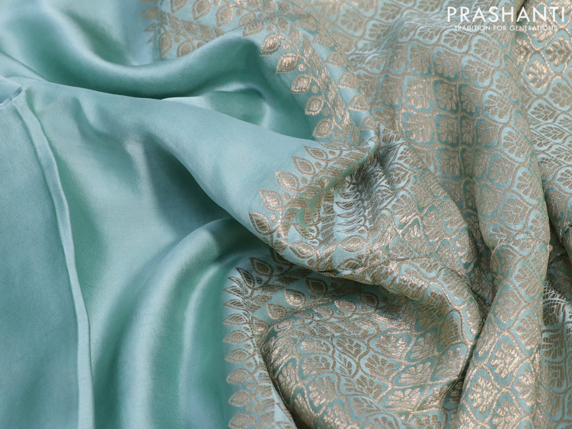 Mushru silk saree pastel blue with plain body and annam zari woven butta border