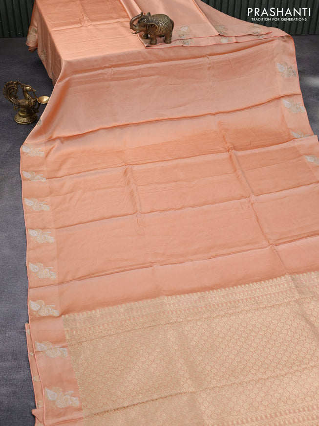 Mushru silk saree pale orange with plain body and annam zari woven butta border