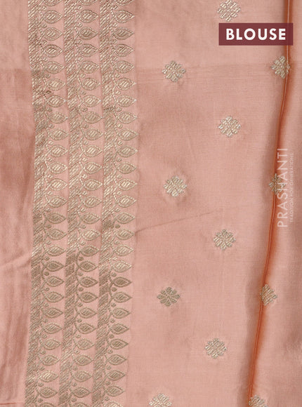 Mushru silk saree pale orange with plain body and annam zari woven butta border