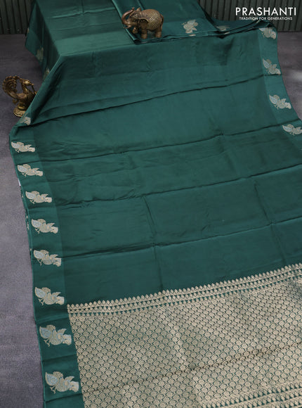 Mushru silk saree green with plain body and annam zari woven butta border