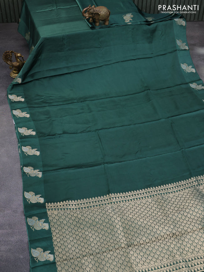 Mushru silk saree green with plain body and annam zari woven butta border