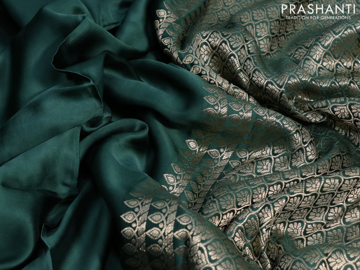 Mushru silk saree green with plain body and annam zari woven butta border