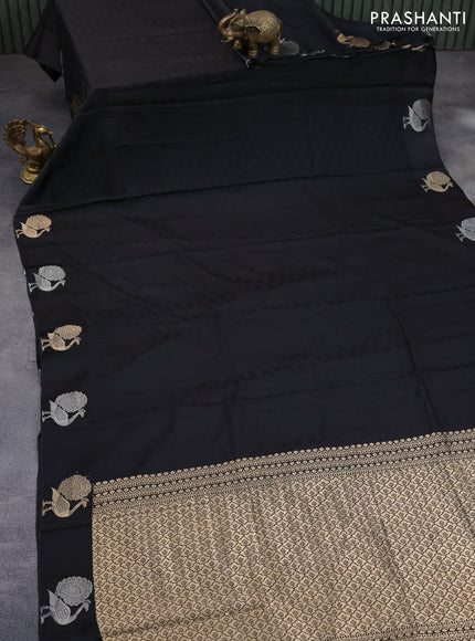 Mushru silk saree black with allover self emboss and peacock zari woven butta border