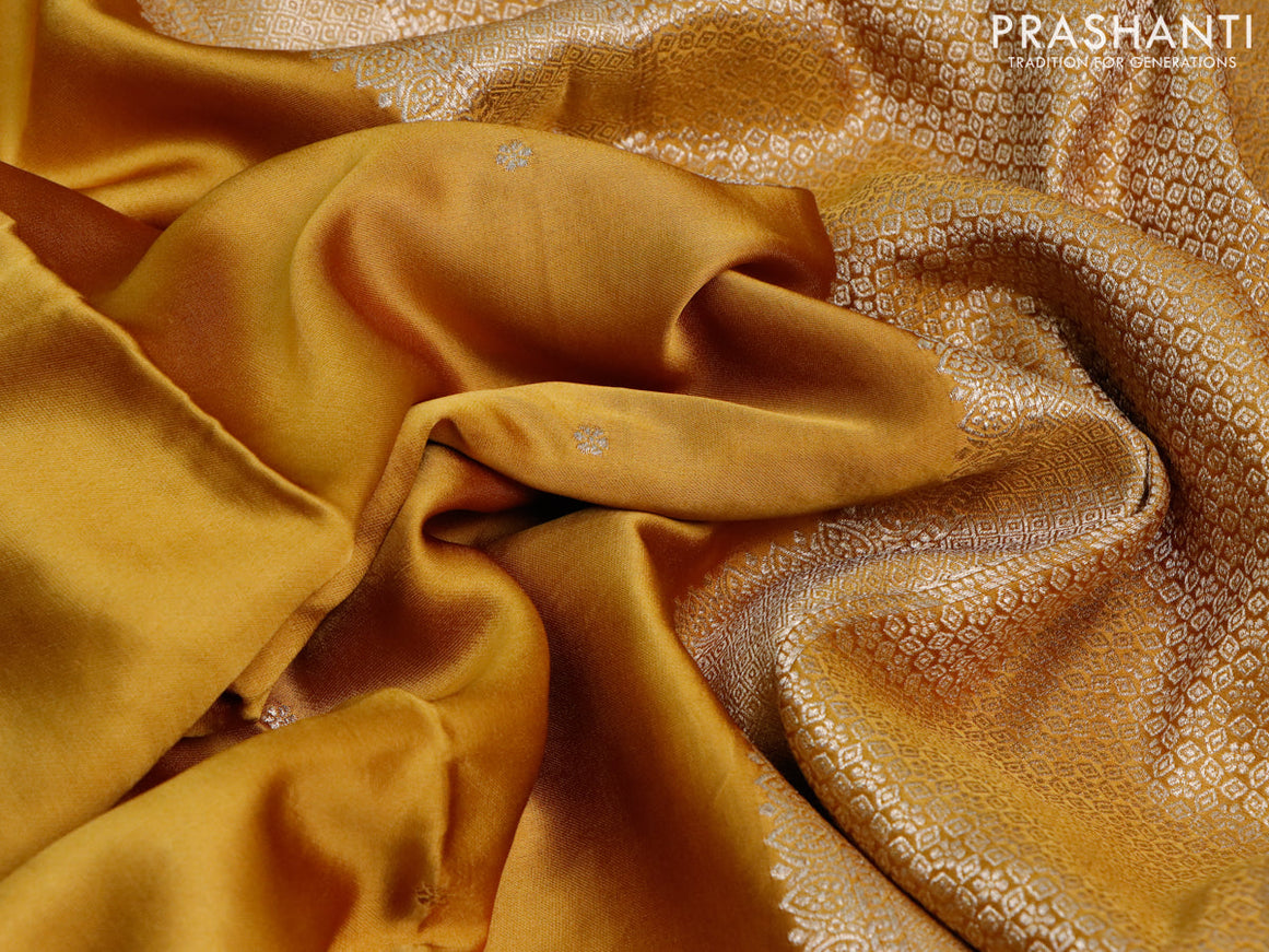 Mushru silk saree dark mustard with zari woven buttas and zari woven butta border