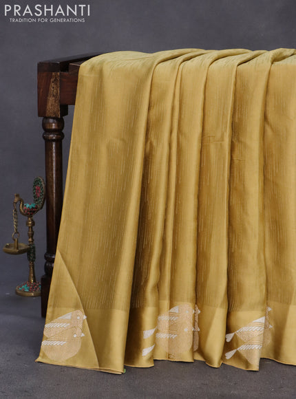 Mushru silk saree mustard shade with allover self emboss and zari woven butta border