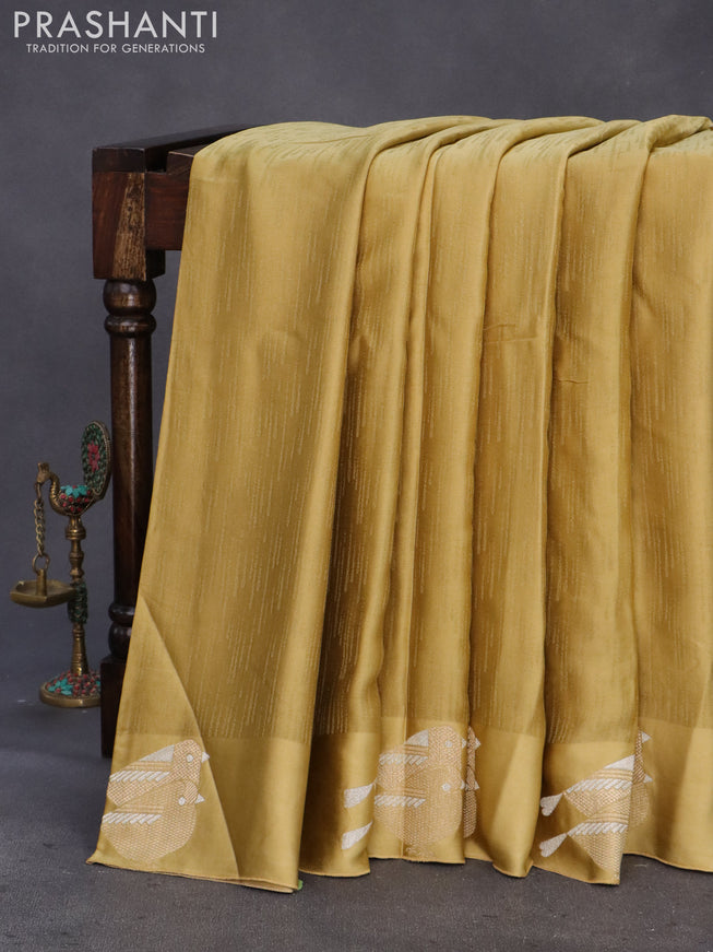 Mushru silk saree mustard shade with allover self emboss and zari woven butta border