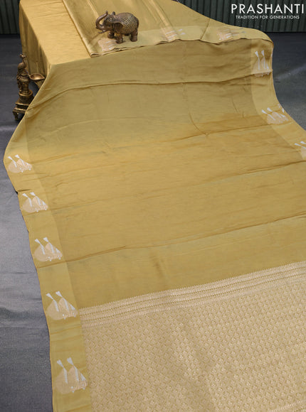 Mushru silk saree mustard shade with allover self emboss and zari woven butta border