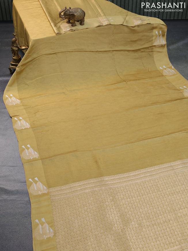 Mushru silk saree mustard shade with allover self emboss and zari woven butta border