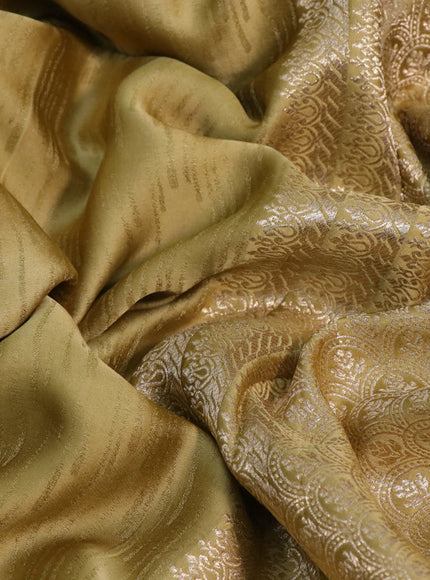 Mushru silk saree mustard shade with allover self emboss and zari woven butta border